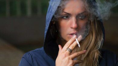 still smoke if pack of cigarettes cost more - woman smoking