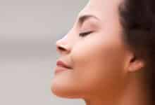 mindfulness for pain - smiling serene woman's face at rest